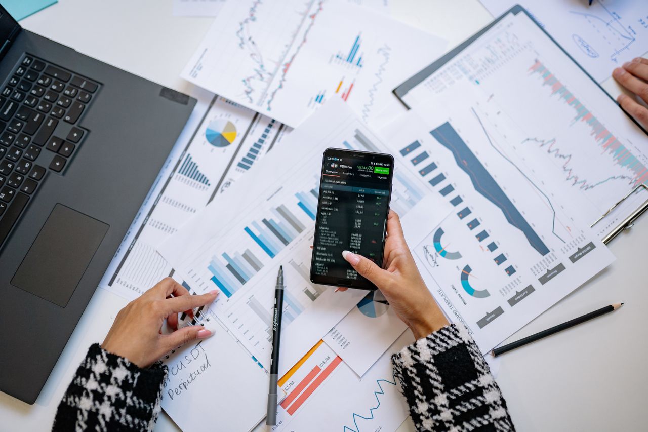 creative A top view on charts and smartphone in an office, showcasing data analytics.