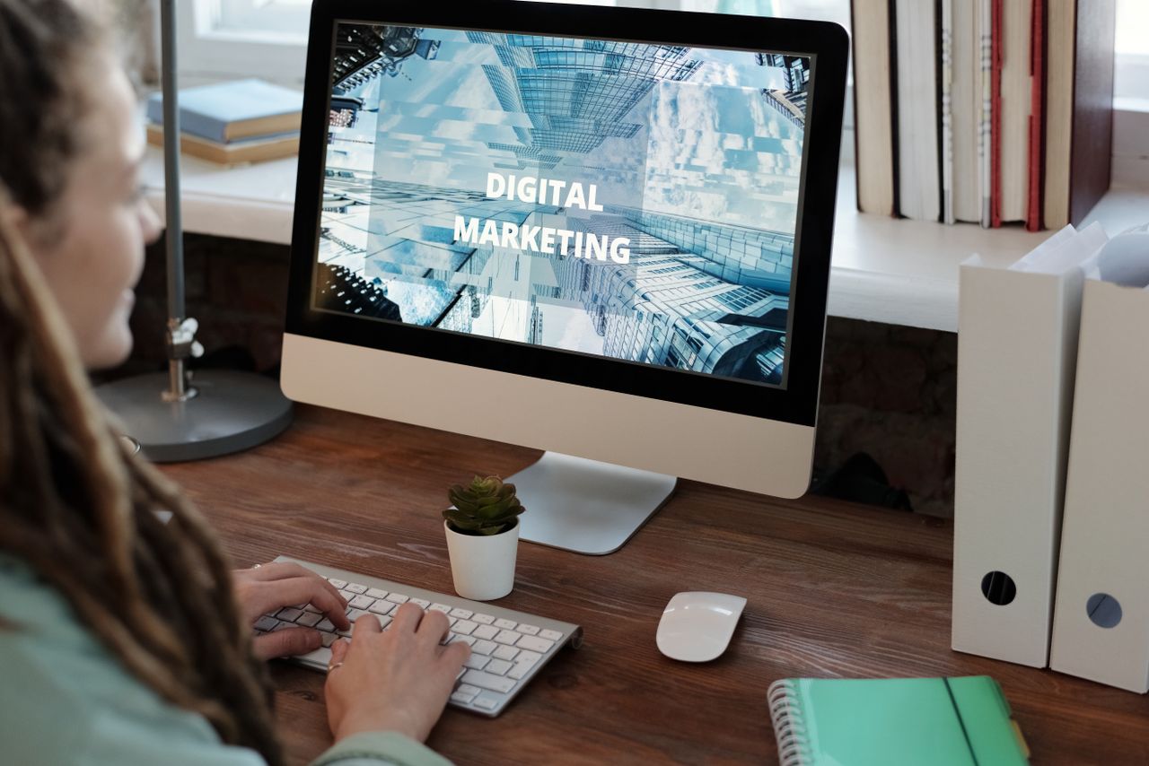 digital Close-up of a woman working on a digital marketing project in a home office setting.